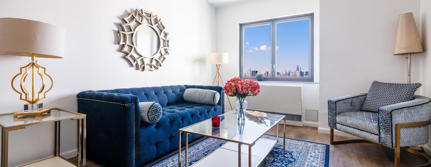 a living room with a blue couch